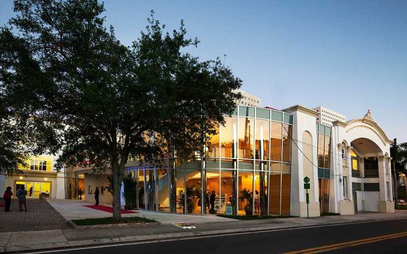 View of a glowing Lyric Theater at dusk