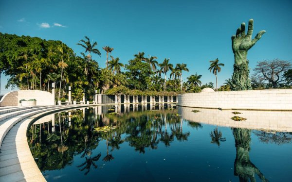 Holocaust Memorial reflecting pool and sculpture lined with palm trees