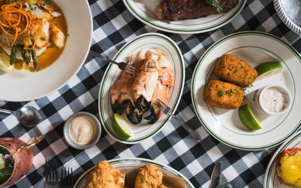 Joe's Stone Crabs spread, plate with stone crabs and side dishes