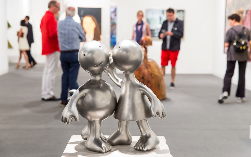 Marlborough Gallery's silver sculpture of a couple telling secrets