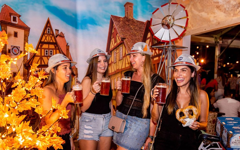 Women celebrating Oktoberfest with beer and pretzels