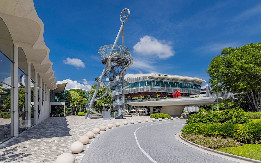 A sleek and modern slide tower at Aventura Mall, offering futuristic excitement and fun for visitors