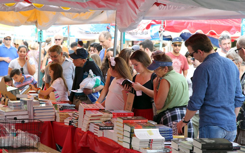 Visitors browsing through books at Miami Book Fair