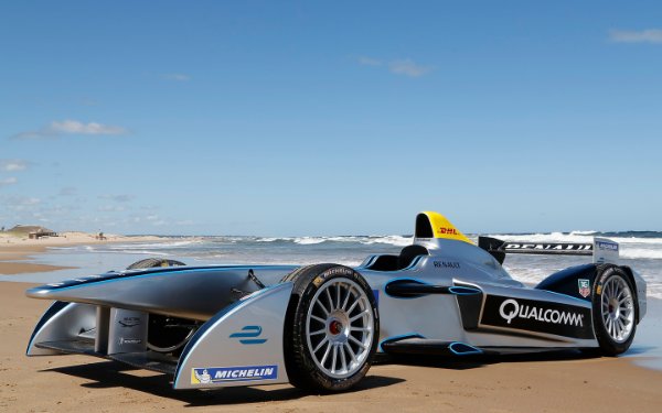 Formula E car parked on the beach