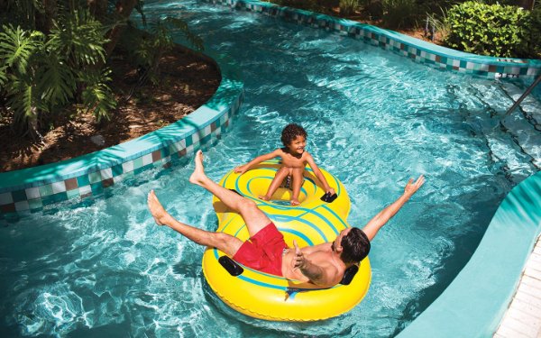 Family floating down the lazy river at JW Marriott Turnberry Resort & Spa