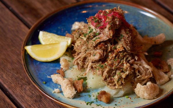 Lechon con chicharrones at Cafe La Trova