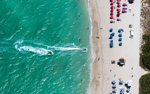 Jet Skis riding to the beach shore