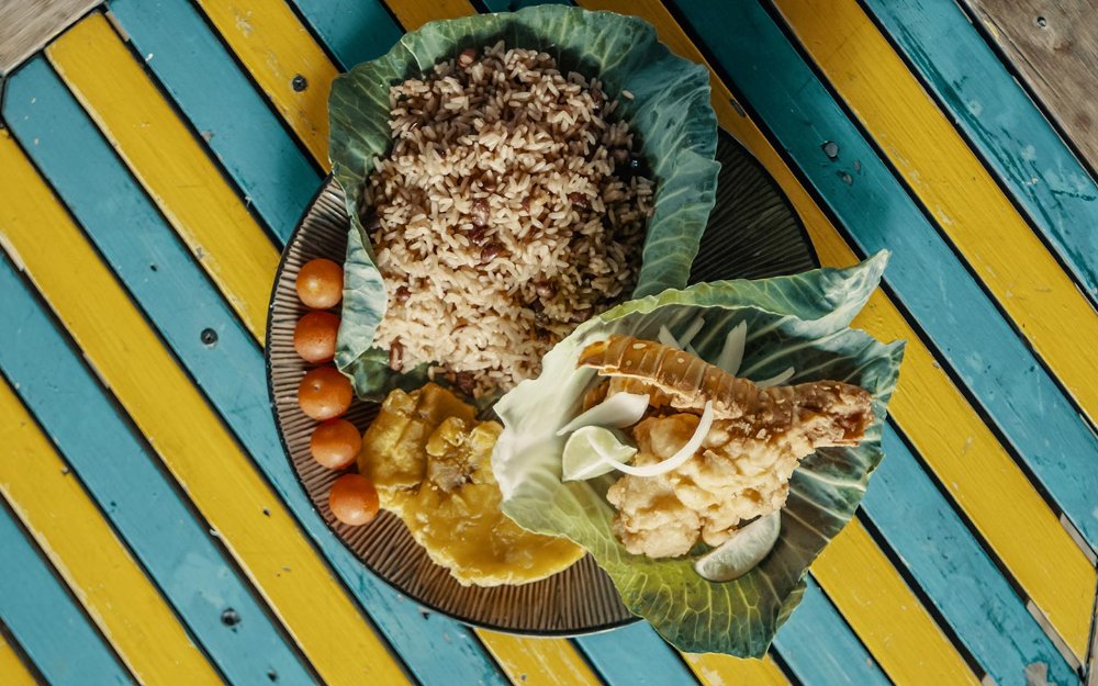 Meals presented in cabbage leaves at Chef Creole