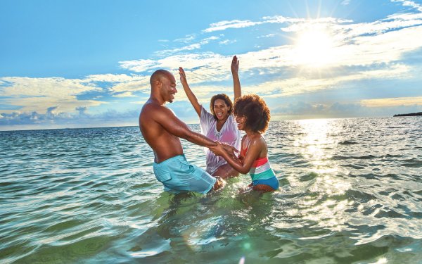 Family in the water in Historic Virginia Key Beach