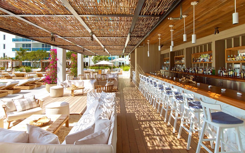 Poolside bar and seating at Sandbox at 1 Hotel