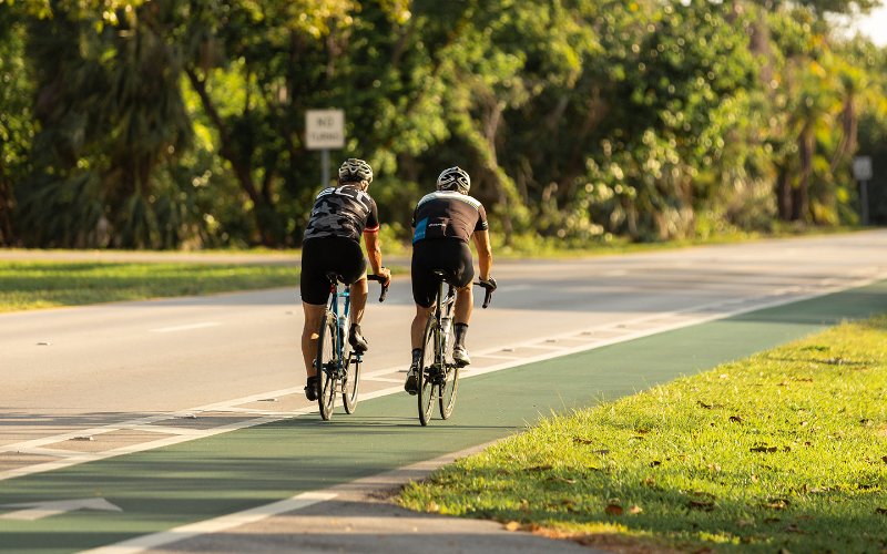 Two Men Riding Bikes in Key Biscayne