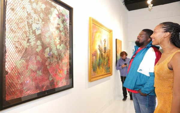 Couple enjoying art at the Haitian Heritage Museum