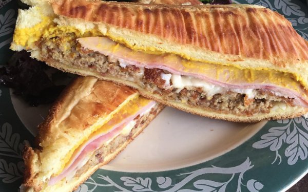 Pressed Cuban sandwich cut in half at La Fresa Francesa